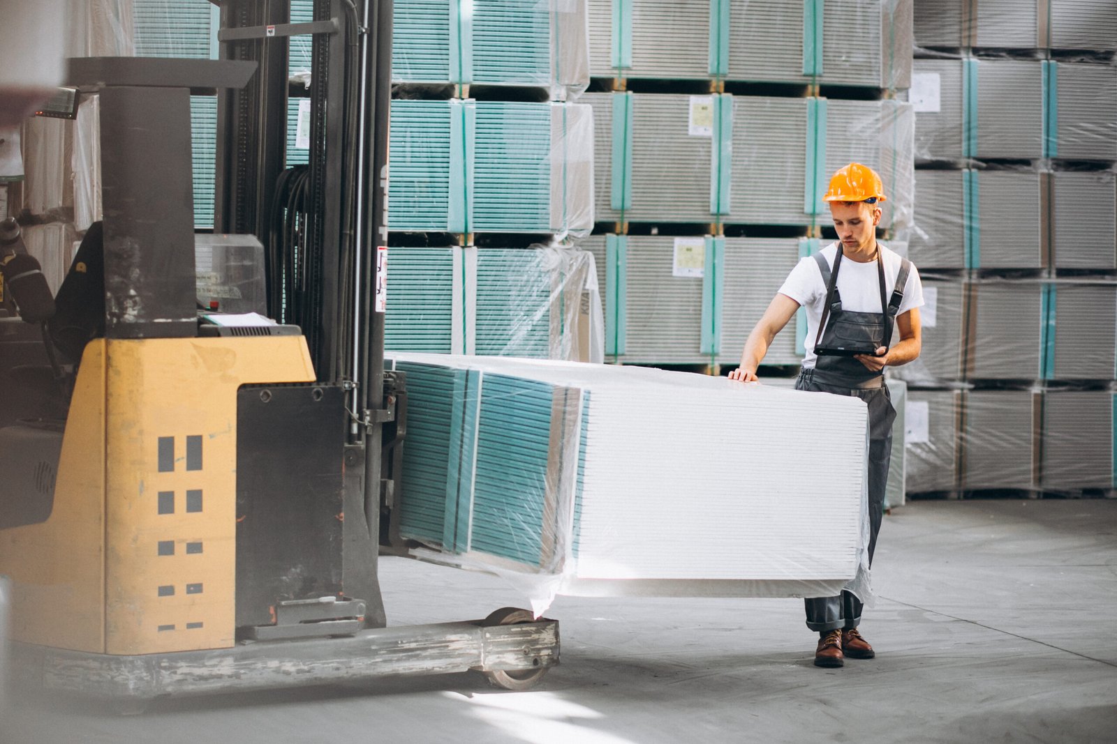 Home young man working at a warehouse with boxes